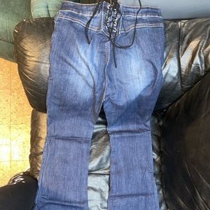 Size 5/6. Tie up in the back, flare Jean.